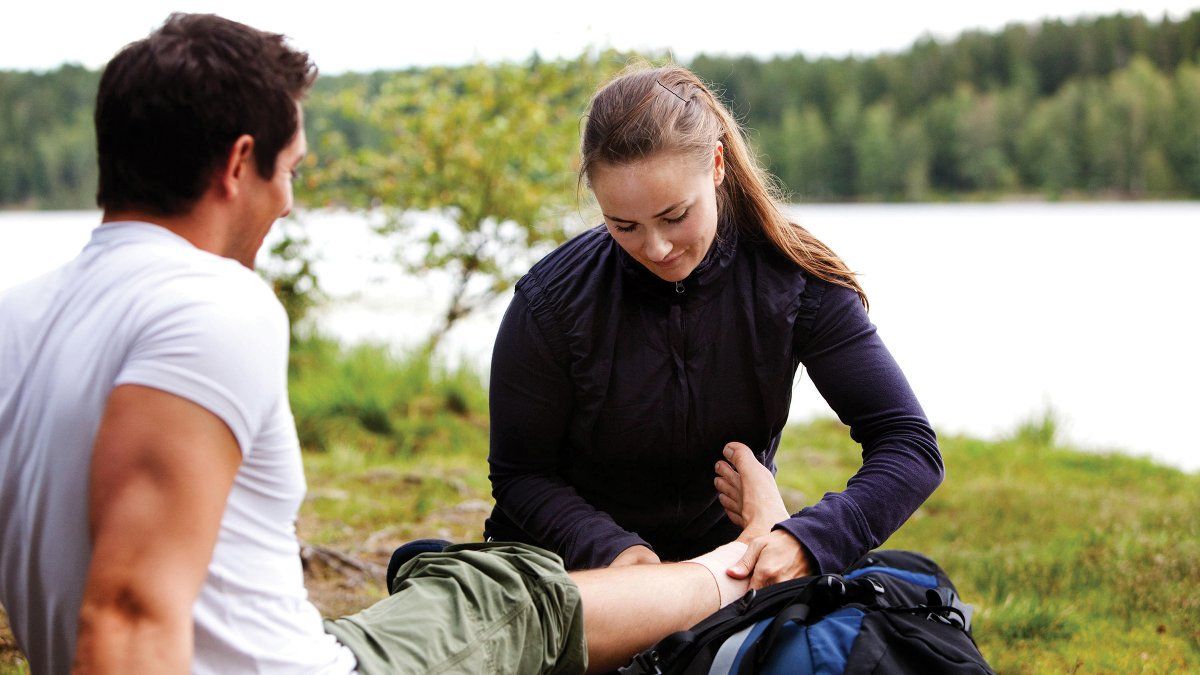 What should you pack in your wound dressing kit when traveling?